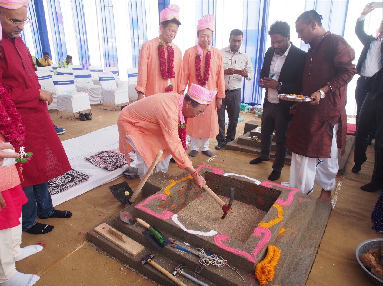 Mr Iwane Matsui, digging the land; process of building construction, which is a part of ground breaking ceremony in India.